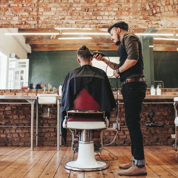 Rear,View,Shot,Of,Handsome,Hairdresser,Cutting,Hair,Of,Male